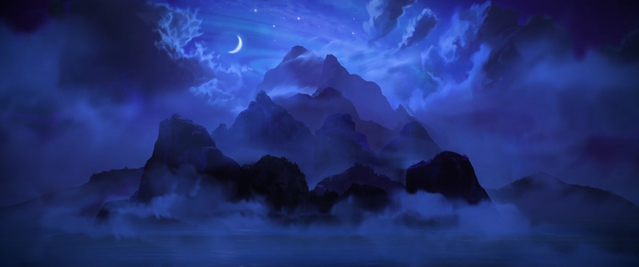 Eine bergige und felsige Insel umgeben von Wolken in der Nacht.